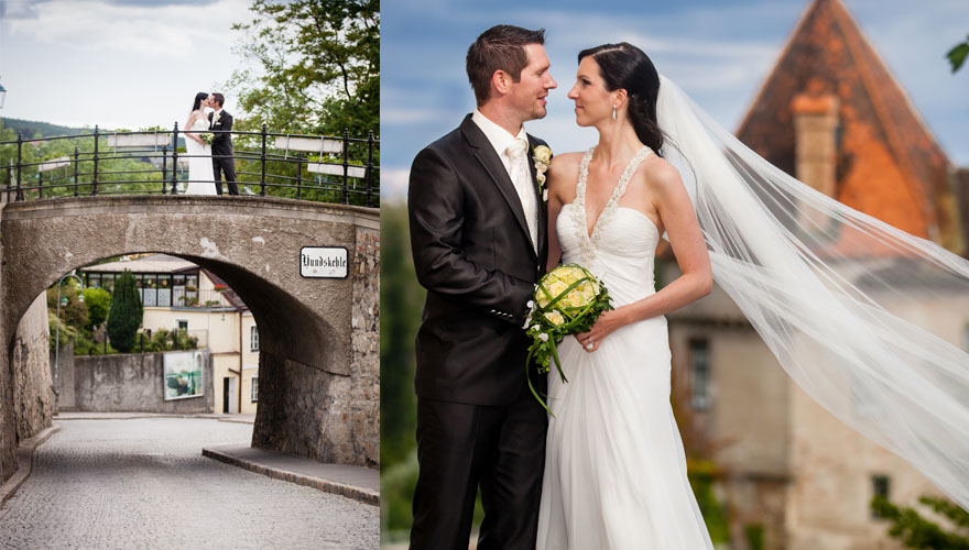 Eine Serie von zwei Fotos. Beim ersten Foto steht ein Brautpaar auf einer steineren Brücke über einer Strasse und küsst sich. Am zweiten Foto hält der Bräutigam seine Braut am Unterarm und presst sie so an seine Brust. Der Schleier der Braut fliegt et